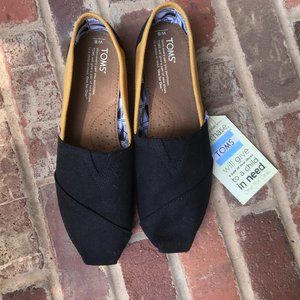 Toms shoes size 8 black and yellow canvas slip ons